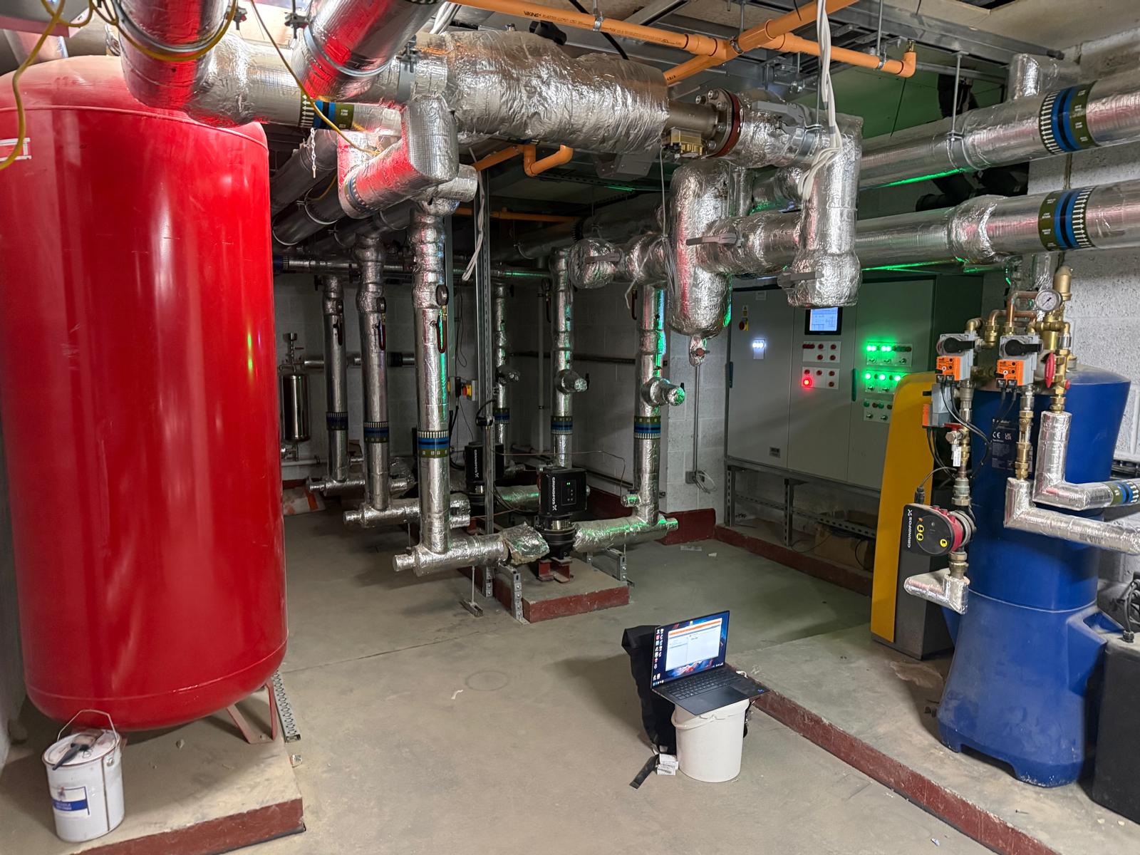 LTHW plantroom with pressurisation vessel, primary pumps and BMS panel commissioned by BIAV Controls