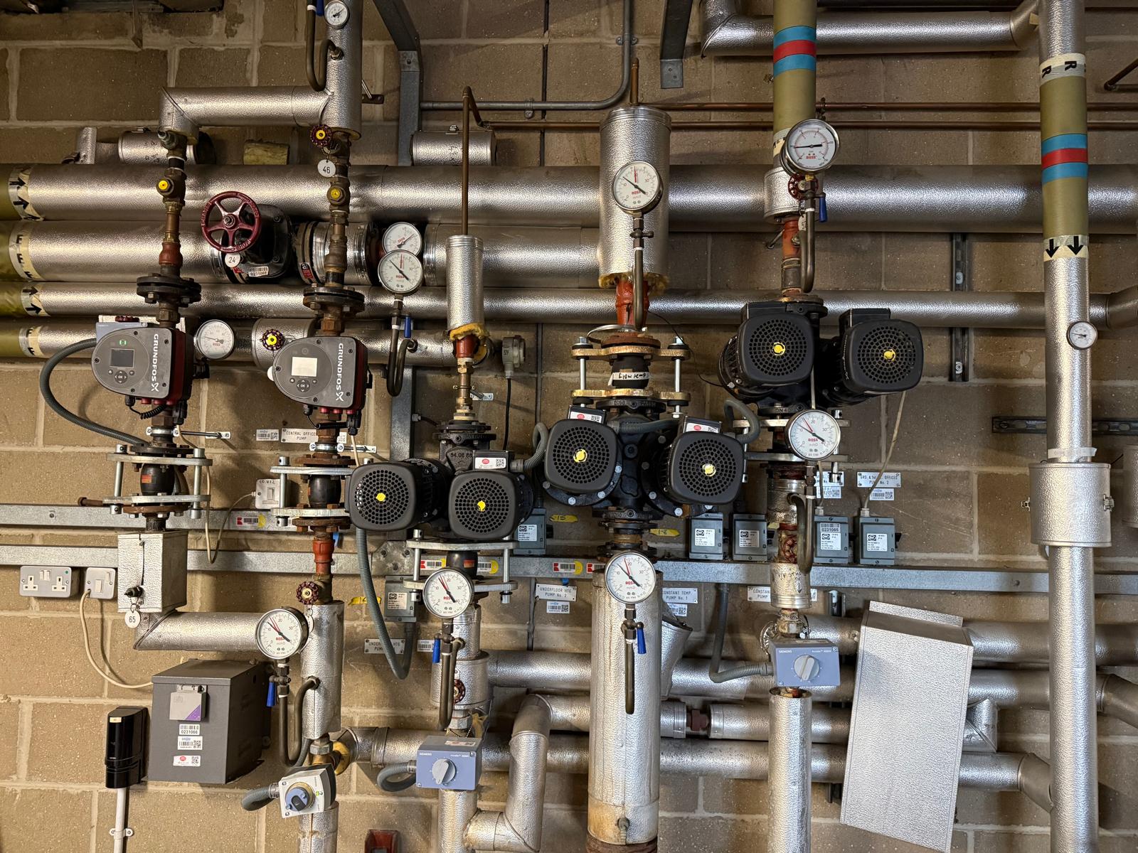 Commercial LTHW plantroom with Grundfos pumps and Siemens actuators maintained under a PPM contract