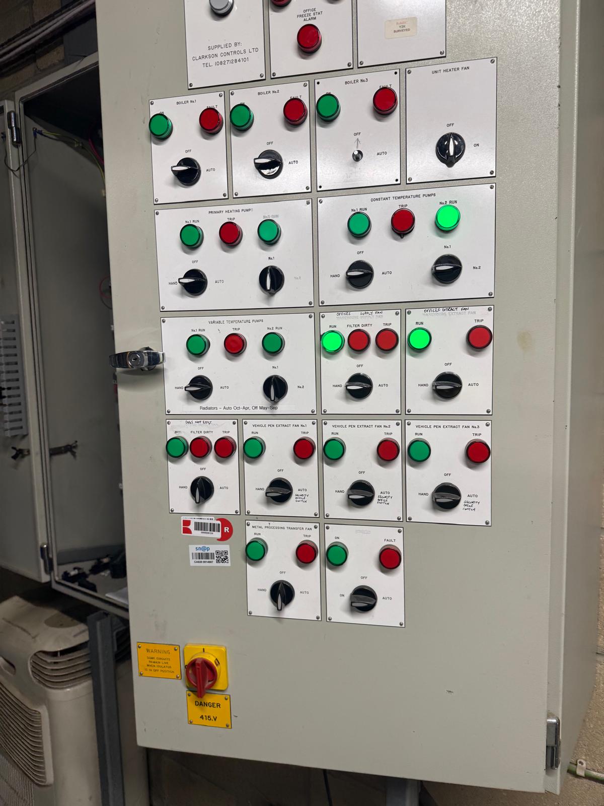 Legacy Clarkson Controls BMS pilot-light mimic with boiler, pump and fan status inspected on a service visit