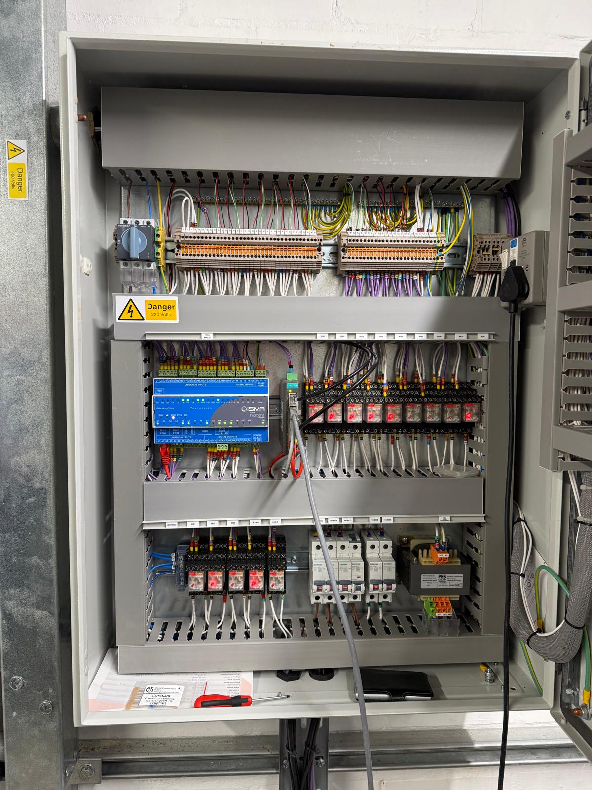 iSMA-Niagara BMS controller with dressed terminals and containment on a school ASHP electrical installation