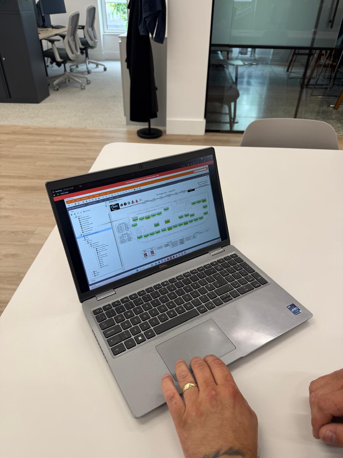 BIAV Controls engineer diagnosing a tenant-floor FCU fault via the BMS graphics on a weekend call-out