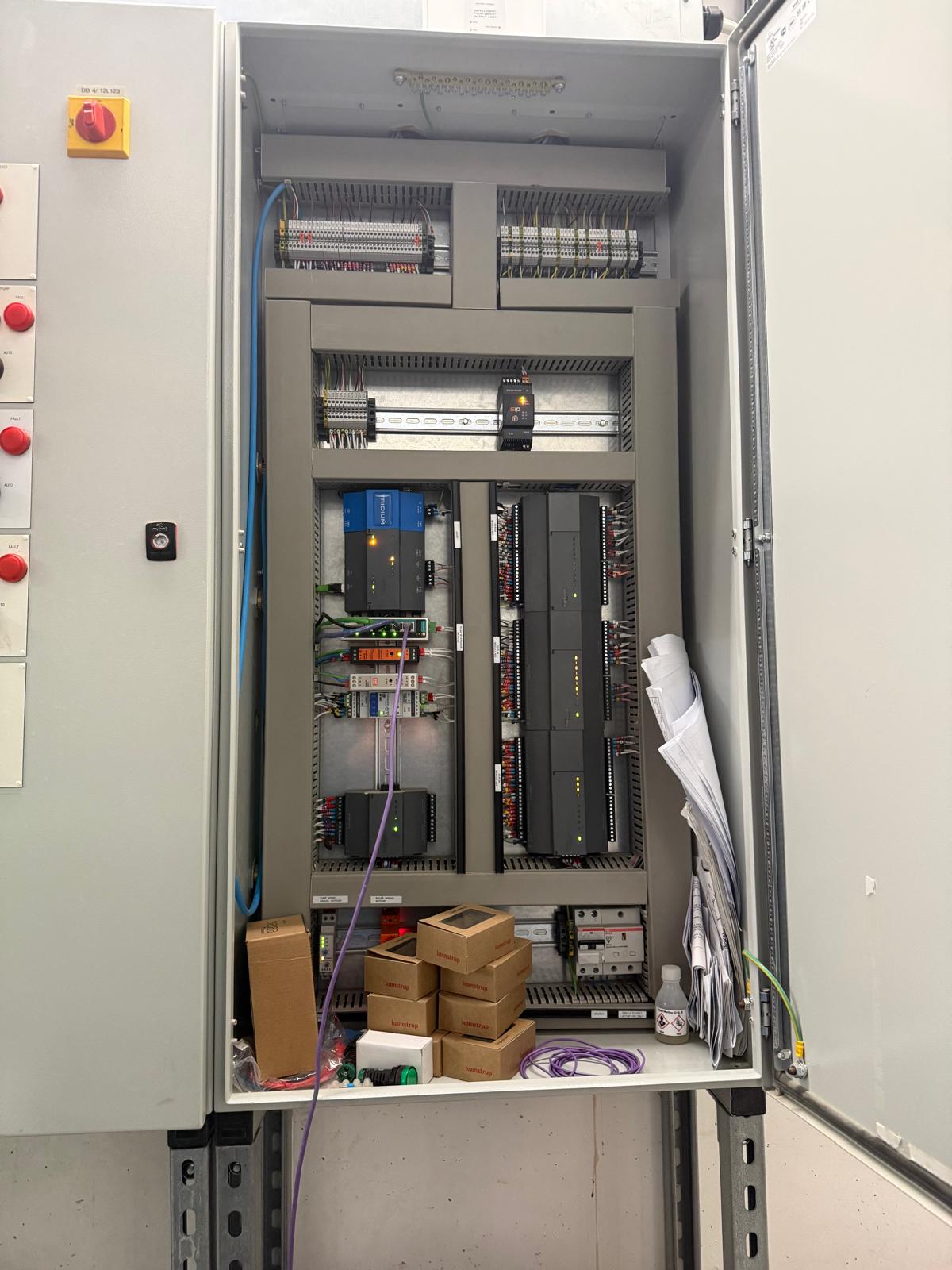 Modern BMS panel with Distech controllers and Kamstrup metering attended on a call-out